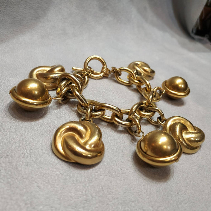 Ann Klein golden charm bracelet vintage - The Hirst Collection