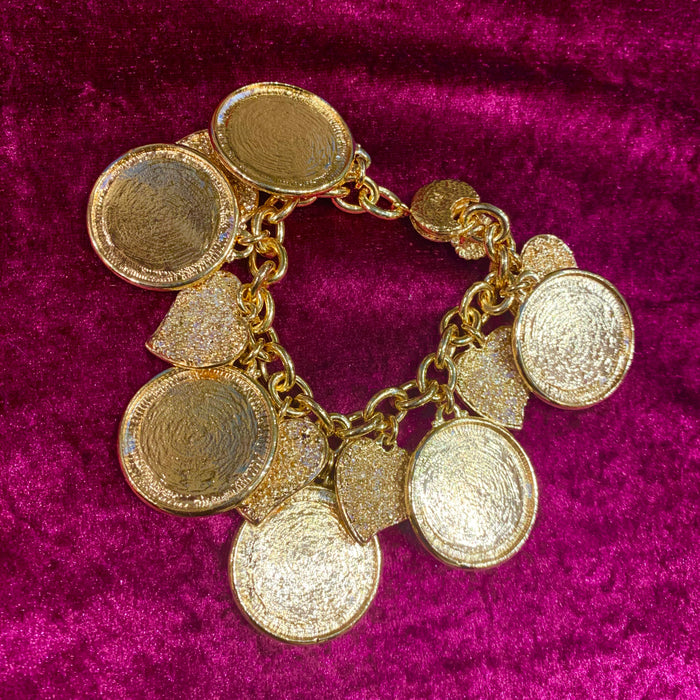 Yves Saint Laurent Gold Charm bracelet with hearts - The Hirst Collection