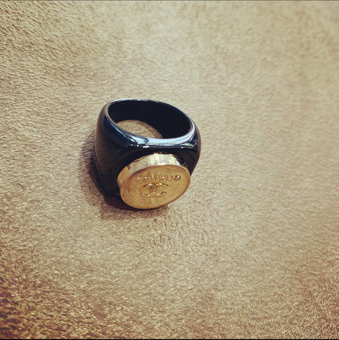Vintage Chanel gold button ring in black setting - The Hirst Collection