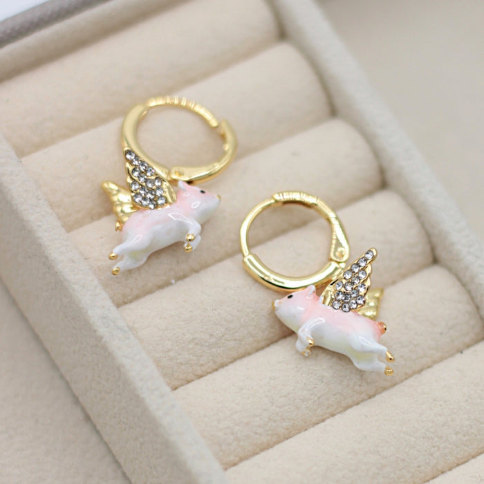 Flying Pig huggie hoop earrings by Bill Skinner