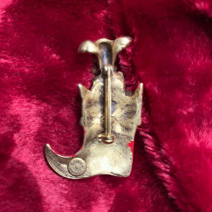 Dog in a stocking Christmas brooch by Butler and Wilson - The Hirst Collection