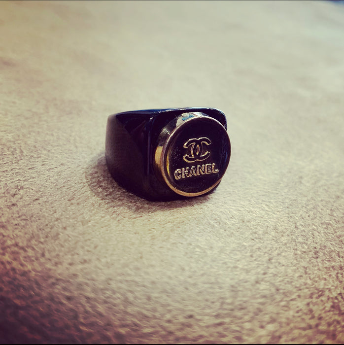 Vintage Chanel gold button ring in black setting - The Hirst Collection