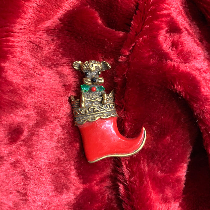 Dog in a stocking Christmas brooch by Butler and Wilson - The Hirst Collection