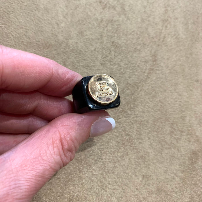 Vintage Chanel gold button ring in black setting - The Hirst Collection