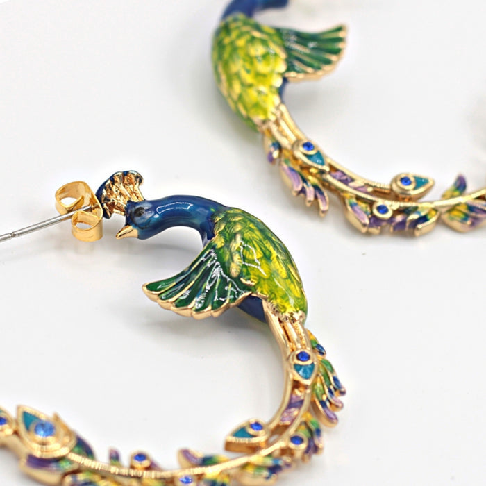Peacock hoop earrings  by Bill Skinner