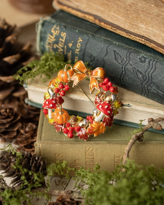 Autumn wreath brooch with pumpkin and toadstools by Bill Skinner