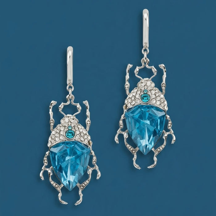 Icy blue bug earrings by Bill Skinner