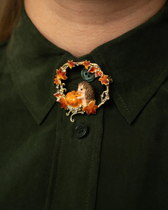 Hedgehog Pumpkin wreath brooch by Bill Skinner