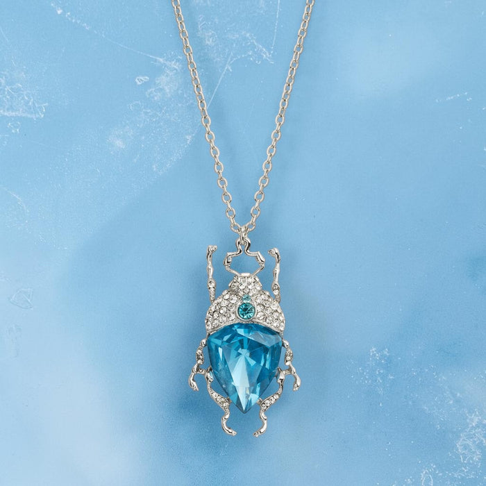 Icy blue bug necklace by Bill Skinner