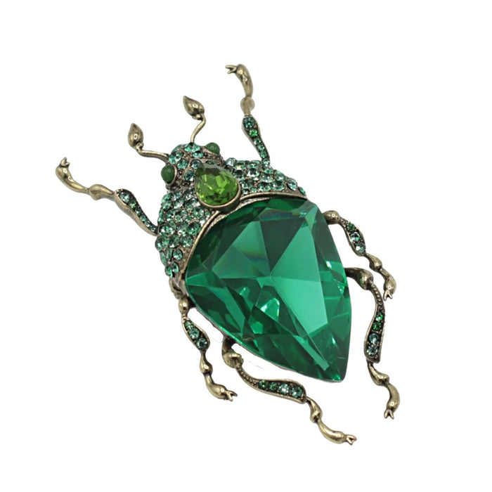 Emerald green bug brooch by Bill Skinner