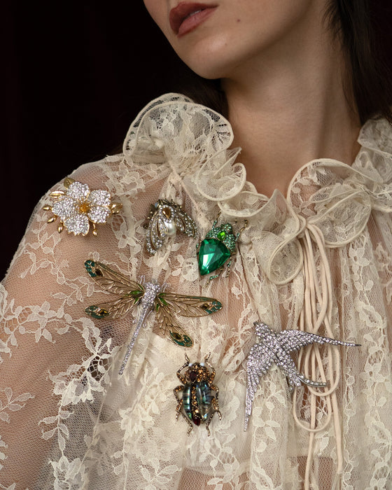 Emerald green bug brooch by Bill Skinner