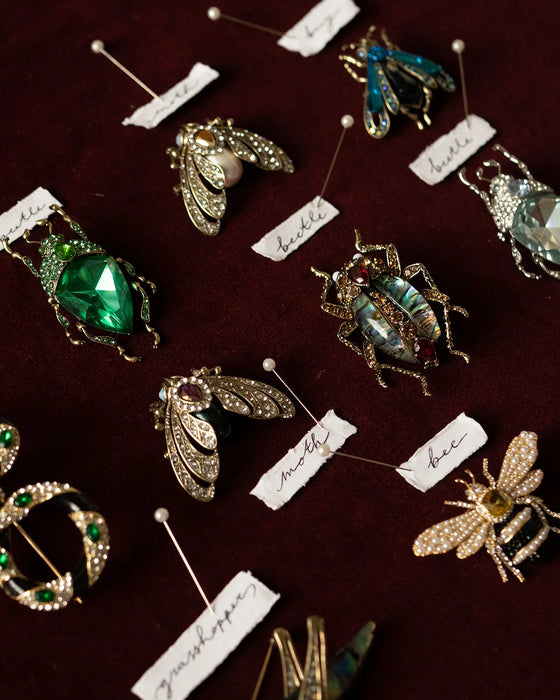 Emerald green bug brooch by Bill Skinner