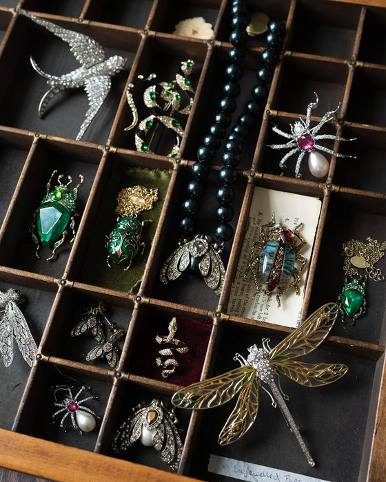 Emerald green bug brooch by Bill Skinner