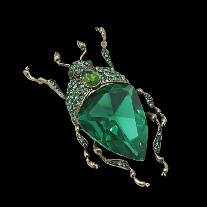 Emerald green bug brooch by Bill Skinner
