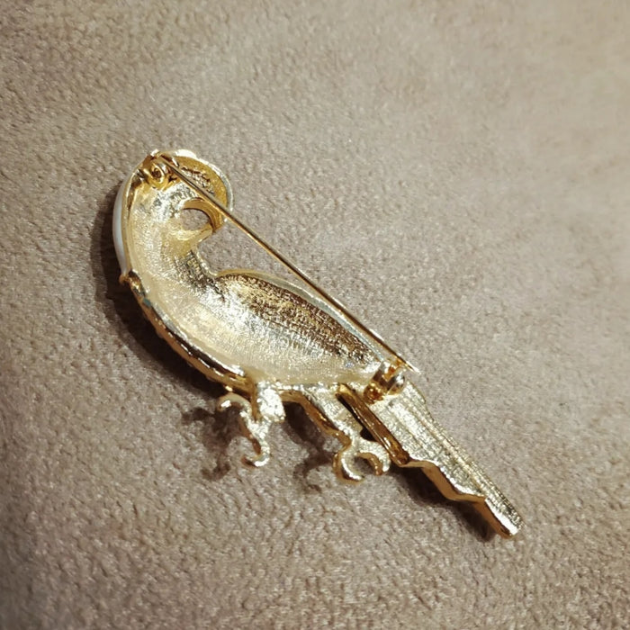 White enamel parrot brooch
