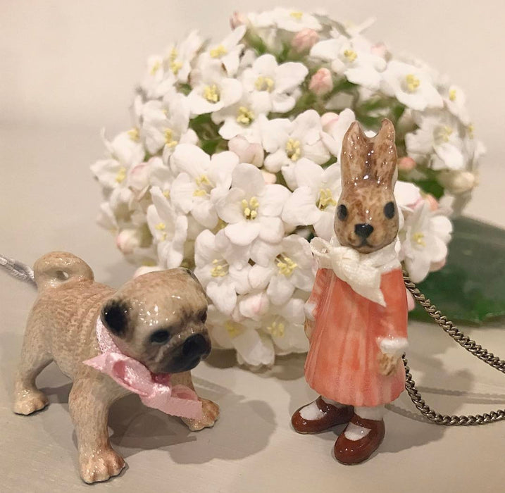 Pug dog pendant by And Mary in tan, porcelaine with bow