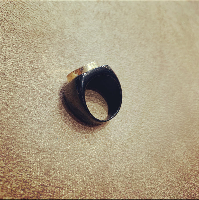 Vintage Chanel gold button ring in black setting - The Hirst Collection