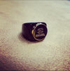 Vintage Chanel gold button ring in black setting - The Hirst Collection
