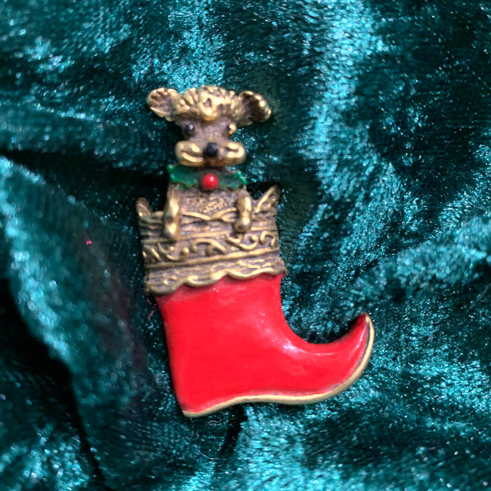Dog in a stocking Christmas brooch by Butler and Wilson - The Hirst Collection