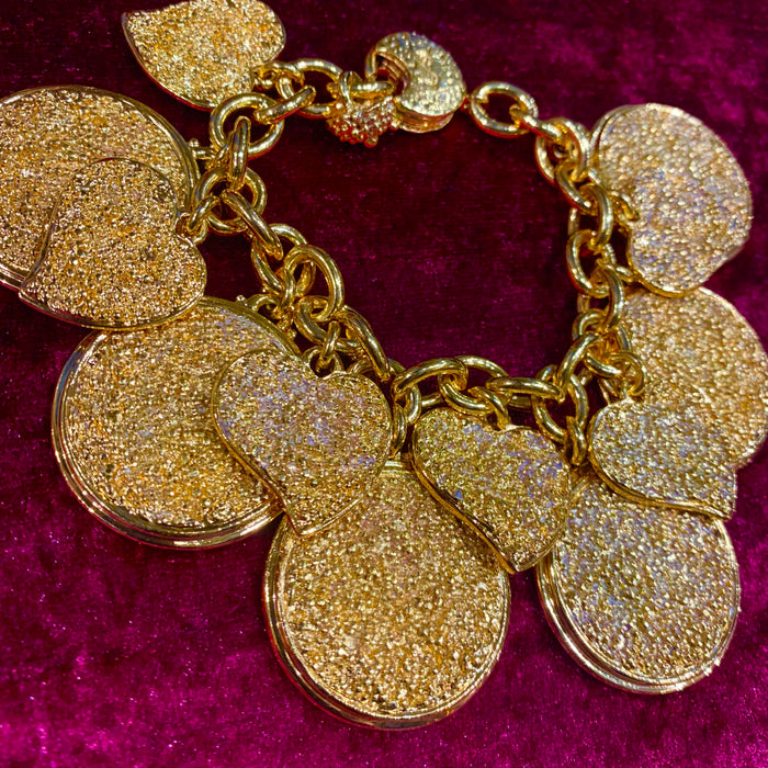 Yves Saint Laurent Gold Charm bracelet with hearts - The Hirst Collection